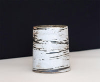 A ceramic tumbler that resemble thin birch trees, were thrown for us by the amazing David Ernster, fired in his wood kiln at his home studio in New Hampshire.