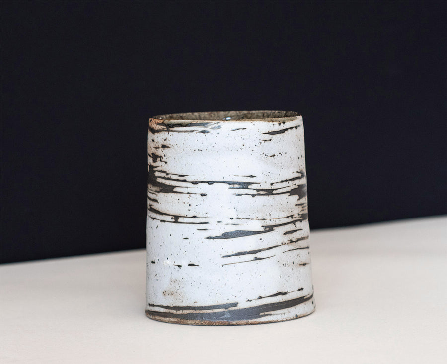 A ceramic tumbler that resemble thin birch trees, were thrown for us by the amazing David Ernster, fired in his wood kiln at his home studio in New Hampshire.